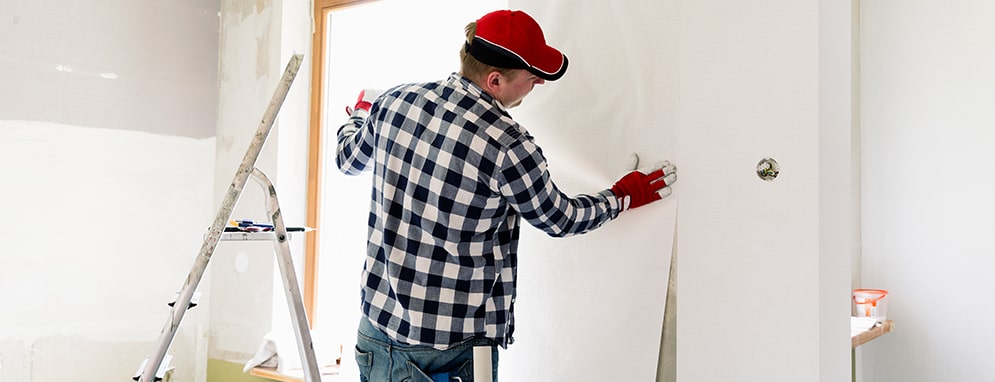 A Professional Wallpaper Installer is Wallpapering the Wall Around the  Window and Removing Air Bubbles Using a Smoother Tool Stock Photo  Image  of smoother glue 197749256